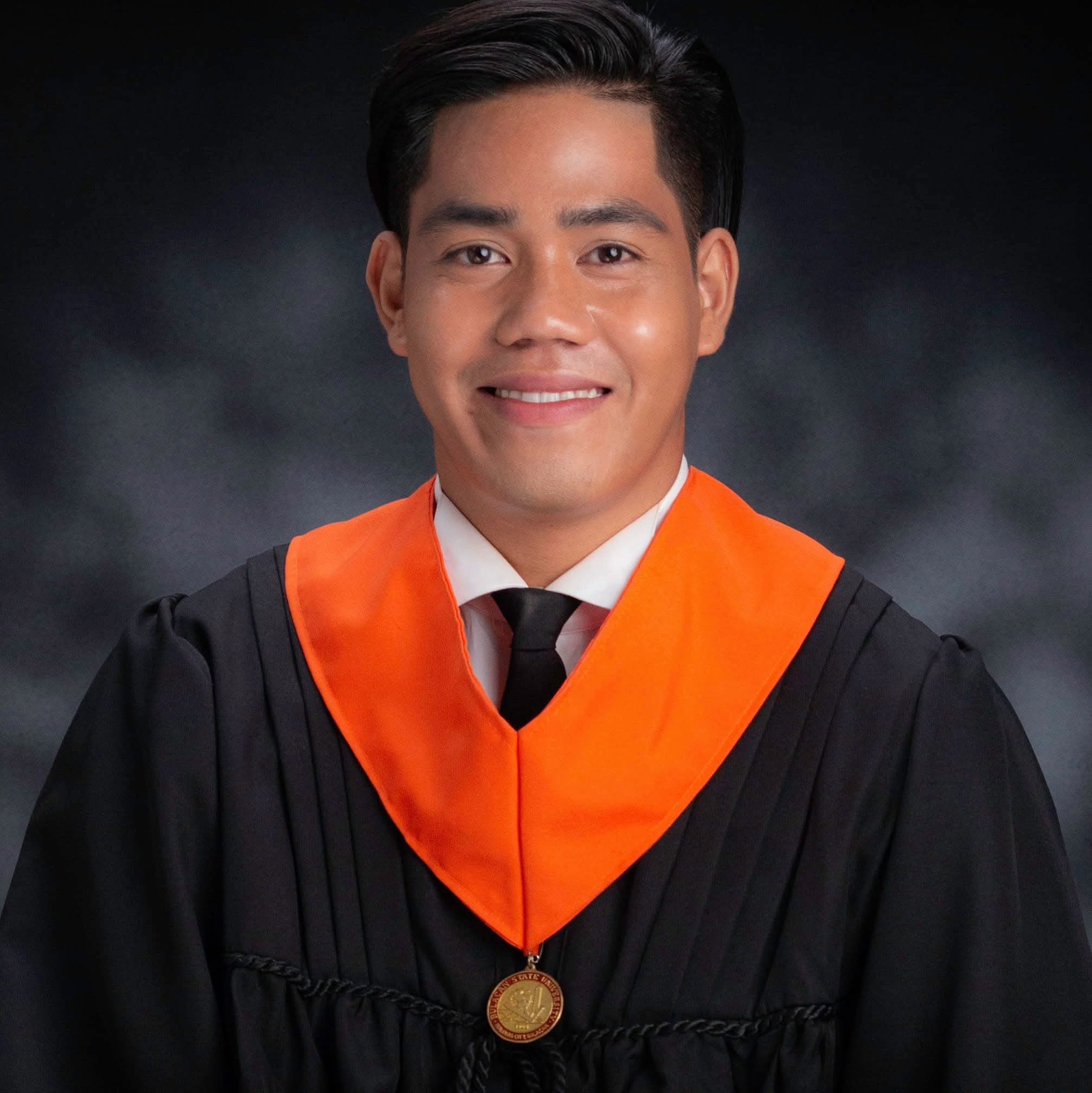 Marvel Bautista wearing his Bulacan State University graduation attire